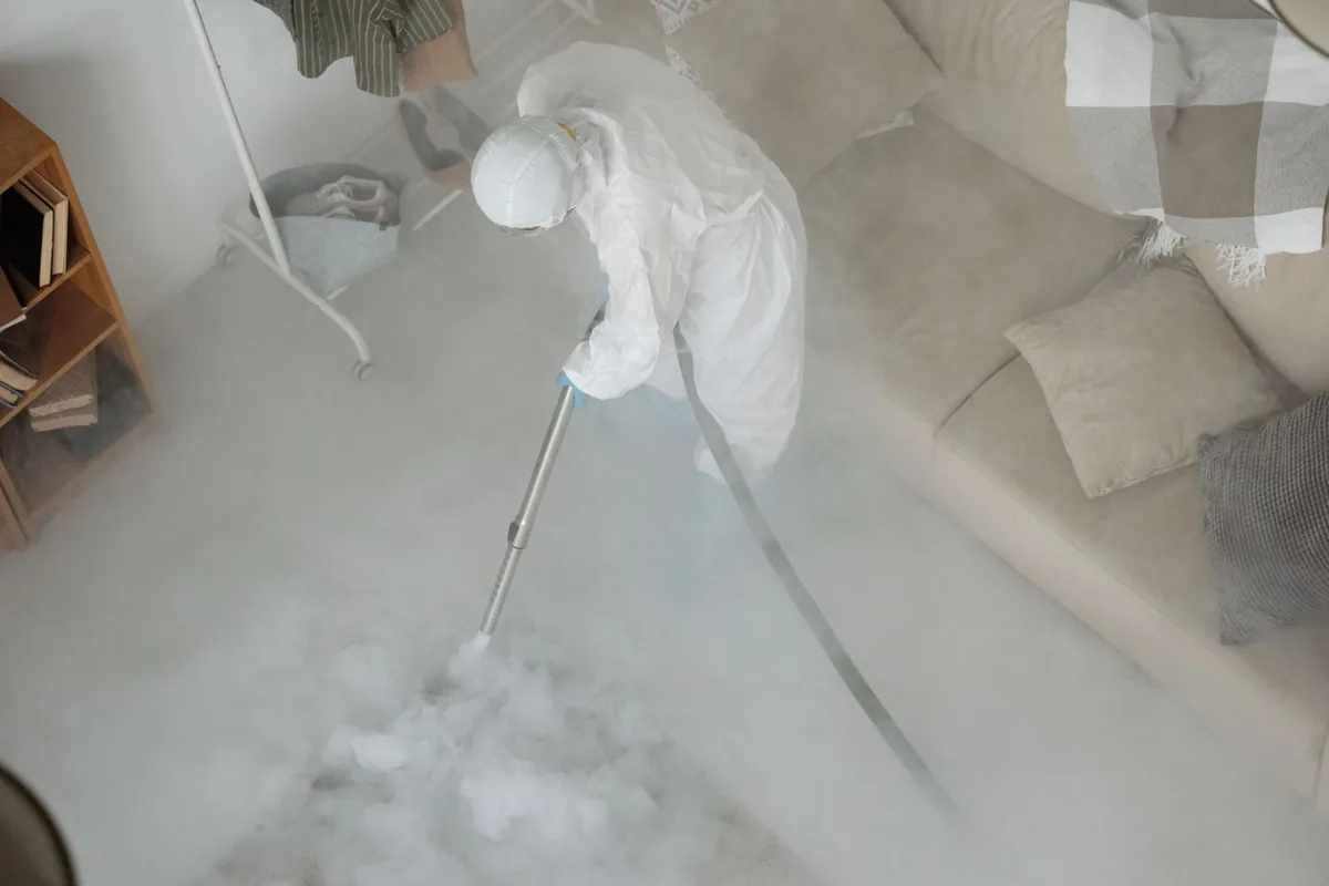 Biohazard cleanup technician in protective equipment, Aurora, CO